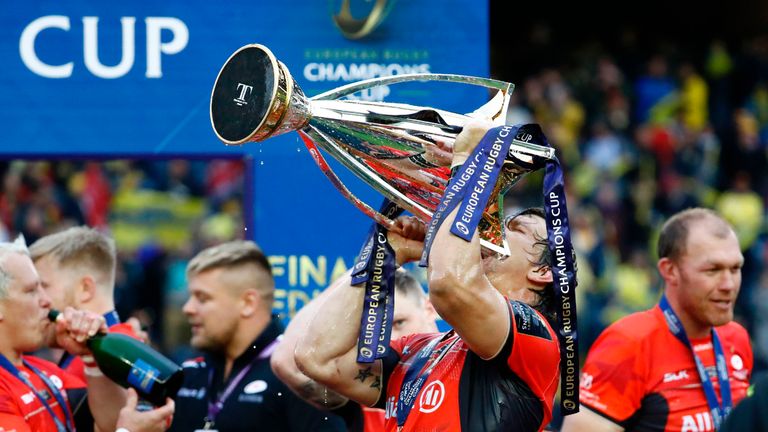 Saracens flanker Michael Rhodes drinks from the trophy as Saracens players celebrate their Champions Cup final win over Clermont 13.05.17