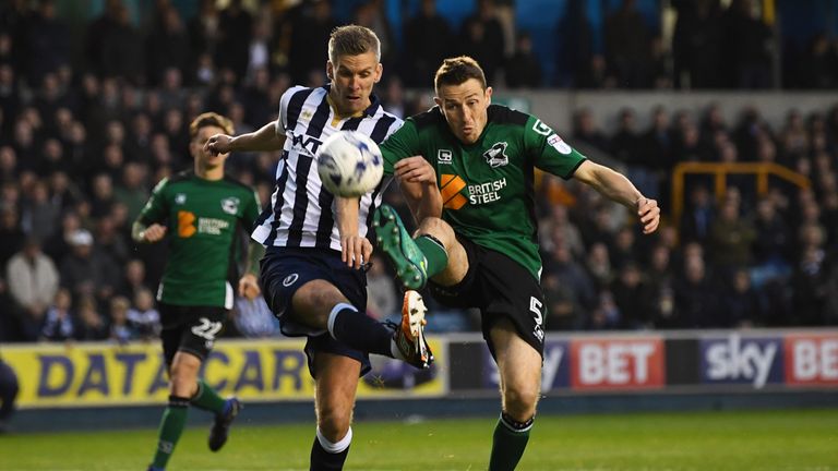 LONDON, ENGLAND - MAY 04:  Steve Morison of Millwall and Murray Wallace of Scunthorpe United battle for the ball during the Sky Bet League One playoff semi