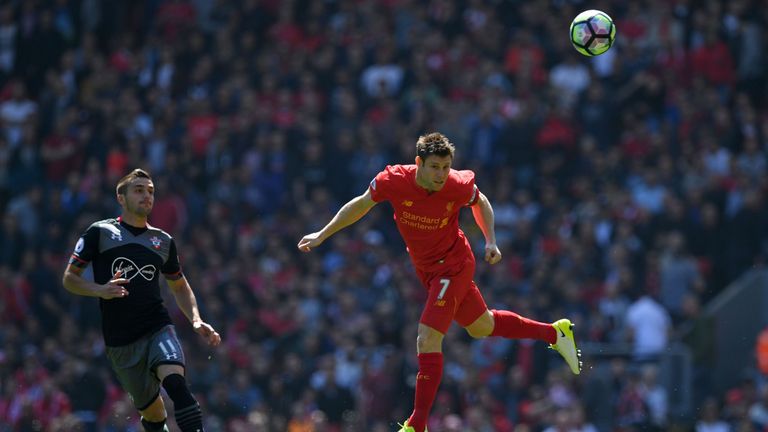 Liverpool's English midfielder James Milner heads the ball during the English Premier League football match between Liverpool and Southampton at Anfield.