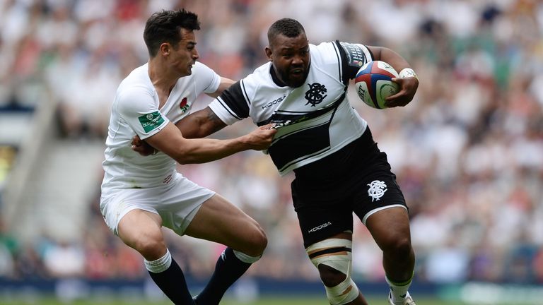 Steffon Armitage  of Barbarians is tackled by Alex Lozowski of England during the Old Mutual Wealth Cup match between England and Barbarians