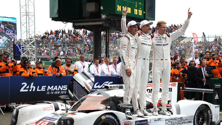 (From L): Britany's Nick Tandy, New Zealand's Earl Bamber and Germany's Nico Hulkenberg celebrate their victory on his  Porsche 919 - Hybrid N?19, after wi