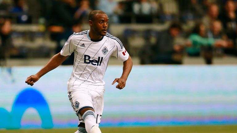 VANCOUVER, CANADA - MARCH 2:  Nigel Reo-Coker #13 of the Vancouver Whitecaps FC kicks the ball up field during their MLS game against Toronto FC at BC Plac