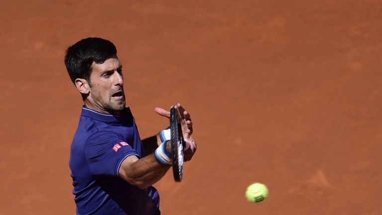 Serbian tennis player Novak Djokovic returns a ball to Spanish tennis player Rafael Nadal during their ATP Madrid Open semifinal match in Madrid, on May 13