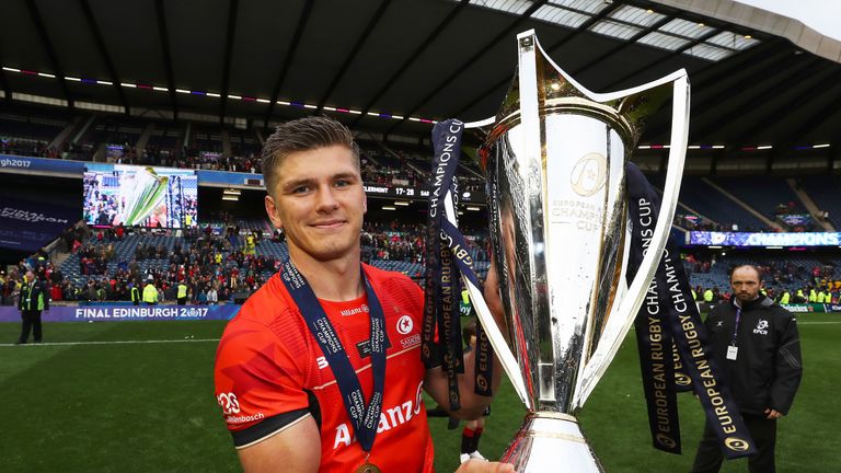 Owen Farrell celebrates with the Champions Cup trophy following his Saracen's 28-17 victory over Clermont Auvergne