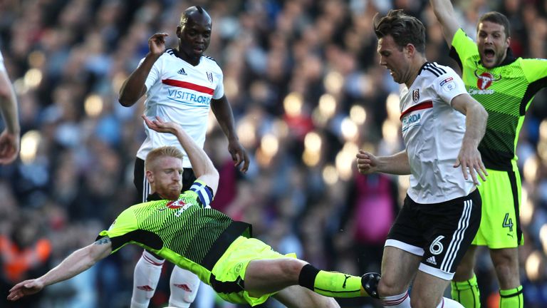 LONDON, ENGLAND - MAY 13: Paul McShane of Reading fouls Kevin McDonald of Fulham and is later sent off for the challenge during the Sky Bet Championship Pl