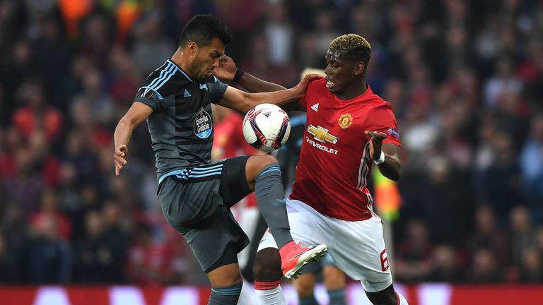 Gustavo Cabral battles with Paul Pogba during the first half at Old Trafford