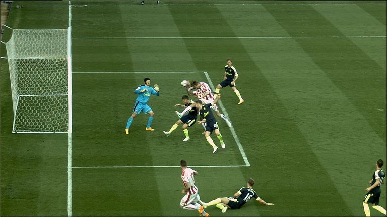 Peter Crouch uses his arm to score against Arsenal