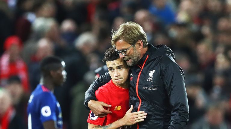 Jurgen Klopp talks with Philippe Coutinho after the match against Manchester United at Anfield