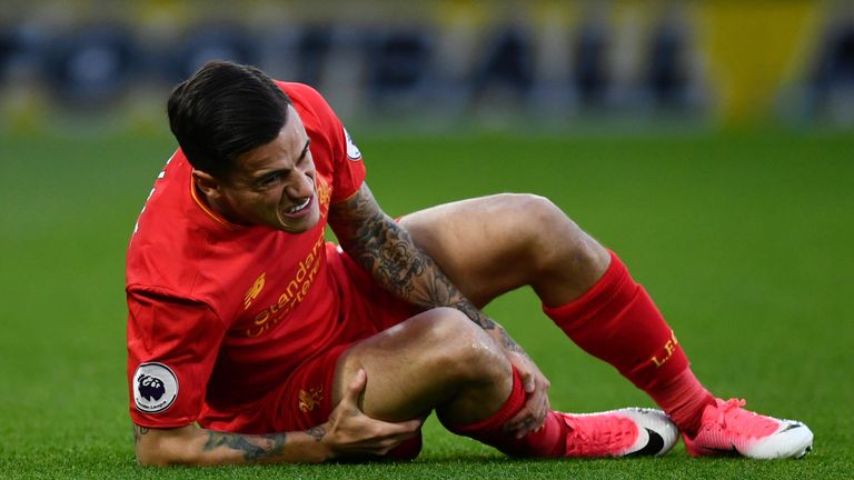 Liverpool midfielder Philippe Coutinho goes down injured