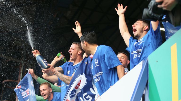 Portsmouth players celebrate winning the league