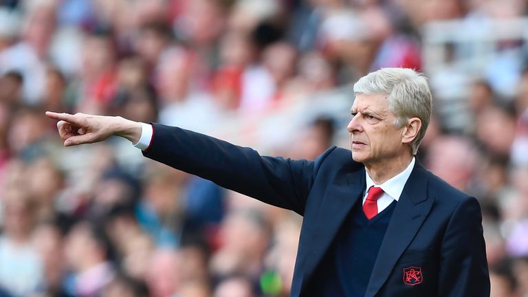 Arsene Wenger gestures from the touchline at the Emirates Stadium