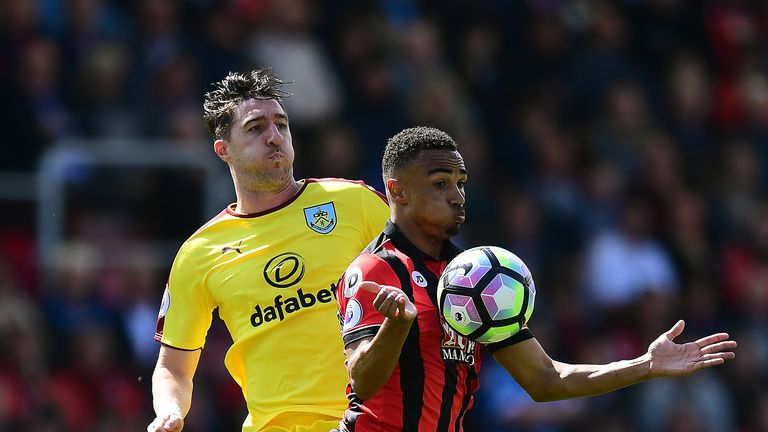 Stephen Ward and Junior Stanislas in action at the Vitality Stadium