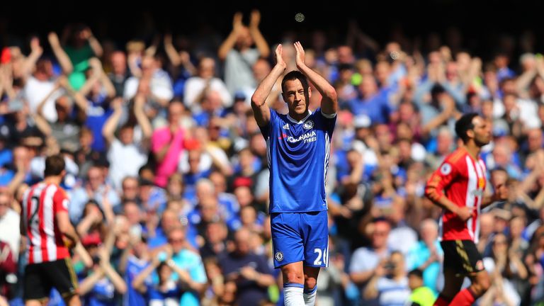John Terry applauds fans as he leaves the pitch after picking up an injury