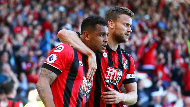 Josh King is congratulated by Bournemouth team-mate Simon Francis after scoring the winner at the Vitality Stadium