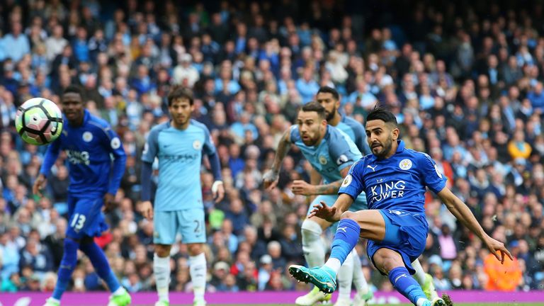 Riyad Mahrez scores his penalty which is later disallowed for taking two touches