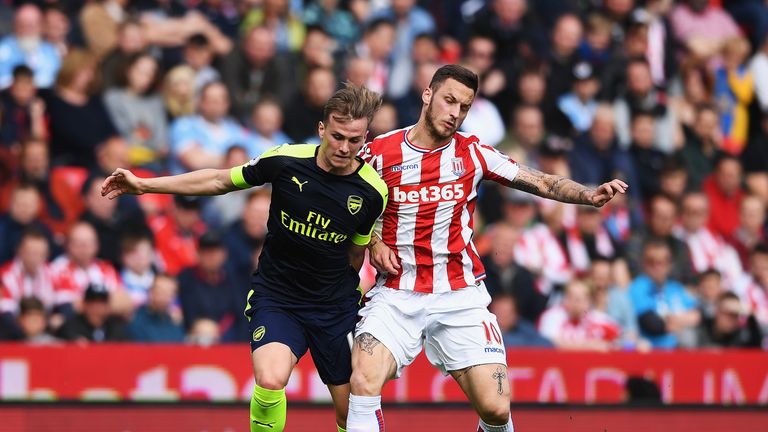Rob Holding and Marko Arnautovic in action at the bet365 Stadium