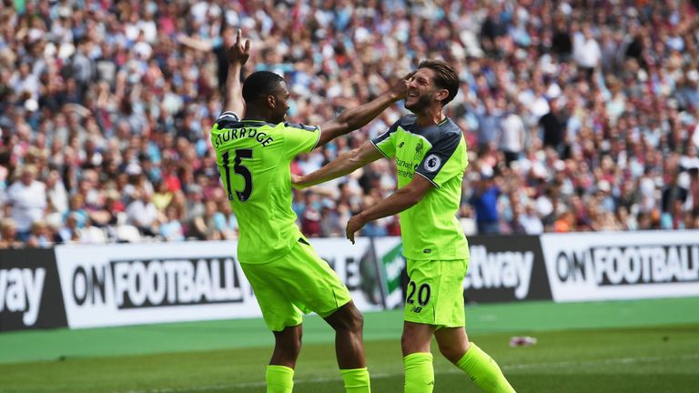 Daniel Sturridge of Liverpool celebrates scoring his side's first goal with Adam Lallana during the Premier League match at West Ham