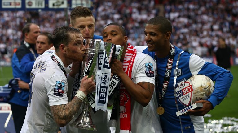 LONDON, ENGLAND - MAY 24:  Preston North End players and staff celebrate after winning the League One play-off final between Preston North End and Swindon 