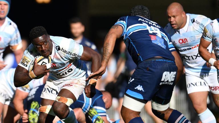 Racing 92's French flanker Yannick Nyanga (L) vies with Montpellier's Fijian flanker Akapusi qera (R) during the French Top 14 rugby union match between Mo