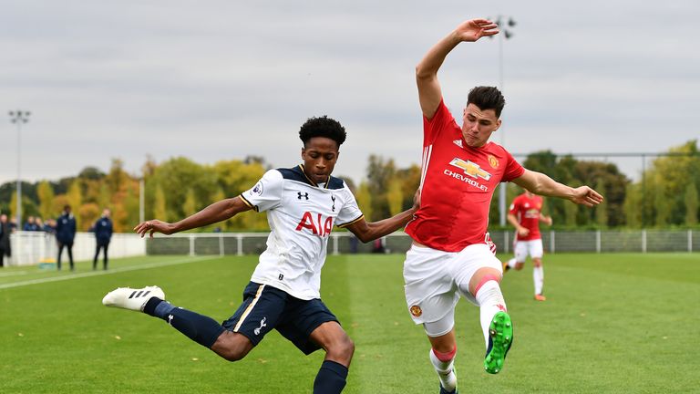 Kyle Walker-Peters of Tottenham Hotspur takes on Regan Poole of Manchester United during the Premier League Two match 