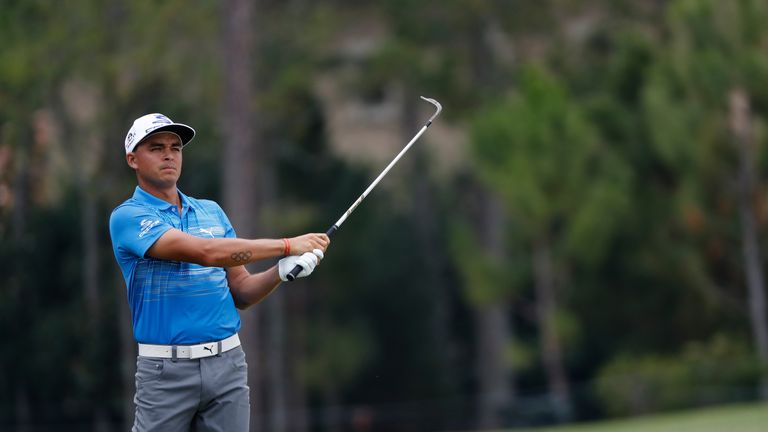 Rickie Fowler of the United States plays a shot on the fourth hole during the third round of THE PLAYERS Championship