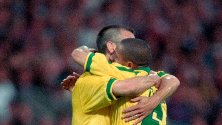 LYON, FRANCE - JUNE 03: Roberto Carlos of Brazil celebrates with his team mate Dunga after scoring a goal from a free kick during the match between France 