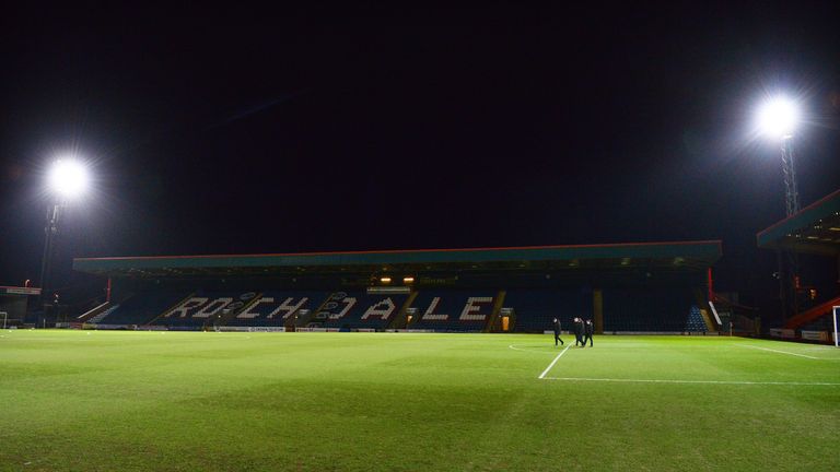 The match officials inspect the pitch ahead of the English FA Cup fourth round football match between Rochdale and Stoke City at Spotland Stadium in Rochda