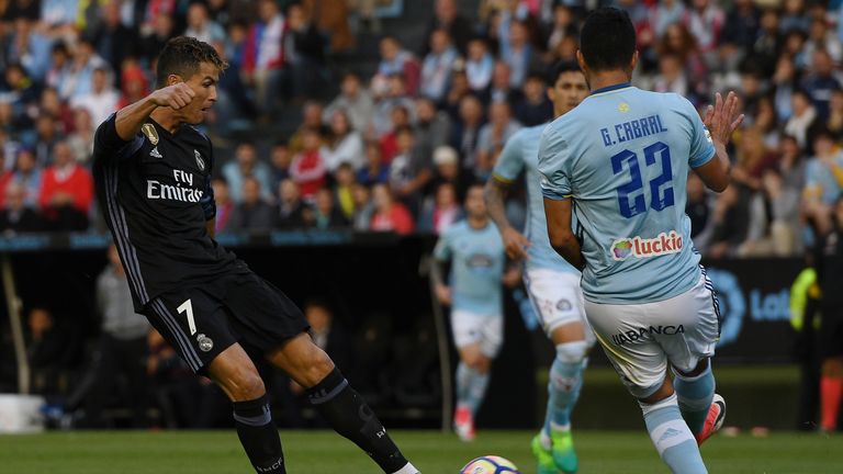 VIGO, SPAIN - MAY 17: Cristiano Ronaldo of Real Madrid scores the first goal against RC Celta during the La Liga match, between Celta Vigo and Real Madrid 