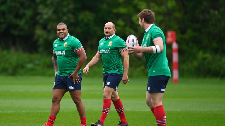 CARDIFF, WALES - MAY 15: Kyle Sinckler and Rory Best look on as Iain Henderson passes the ball during a British and Irish Lions training session at Vale of