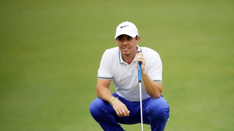Rory McIlroy of Northern Ireland lines up a birdie putt on the second green during the third round of THE PLAYERS Championship