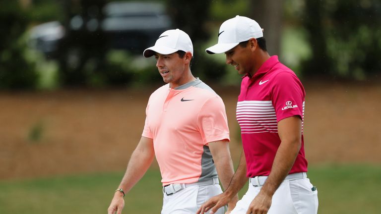 Rory McIlroy of Northern Ireland and Jason Day of Australia walk on the first hole during the final round of THE PLAYERS Championship