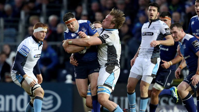 Leinster's Fergus McFadden is tackled by Jonny Gray