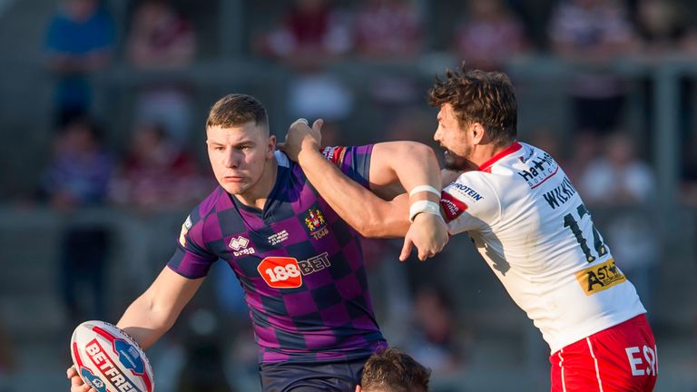 George Williams is tackled by St Helens' Alex Walmsley and John Wilkin