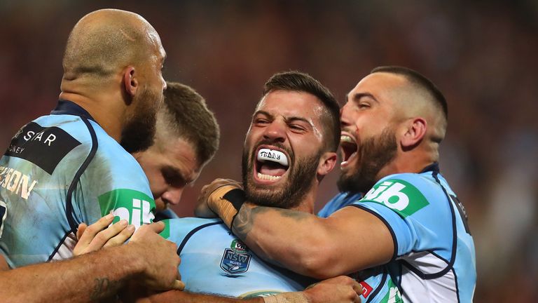 James Tedesco celebrates with his team-mates after scoring a try