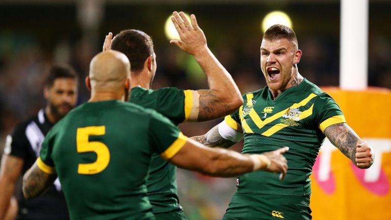 Josh Dugan (right) scored Australia's first try but was forced off with a suspected fractured cheekbone