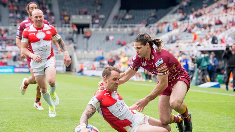 Jake Mamo is unable to prevent Richie Myler from scoring the opening try