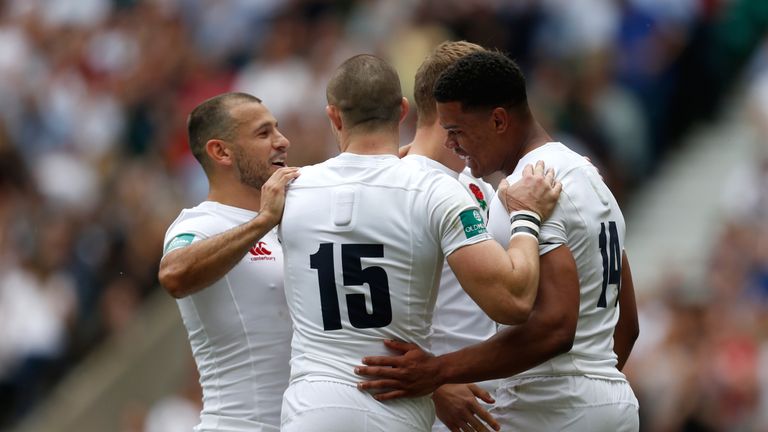 England's Nathan Earle (right) celebrates scoring his side's first try during the Old Mutal Wealth Cup match v Barbarians at Twickenham Stadium, London