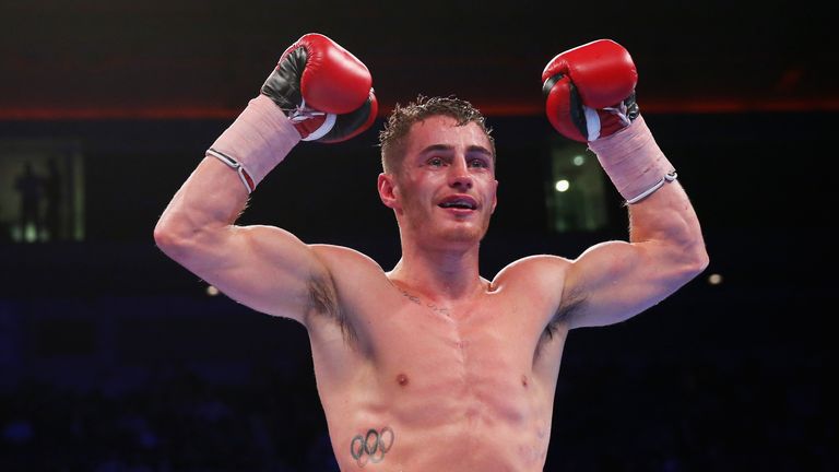 Ryan Burnett celebrates after winning in the British Bantamweight Championship match