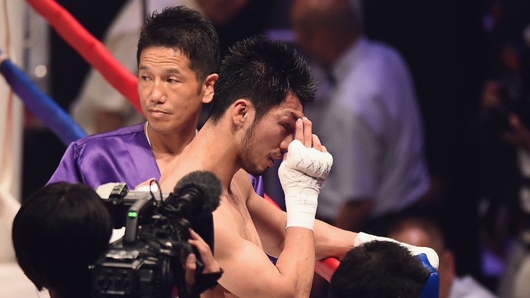 TOKYO, JAPAN - MAY 20:  Ryota Murata of Japan looks dejected during the WBA World Middleweight title bout between Hassan N'Dam N'Jikam and Ryota Murata at 