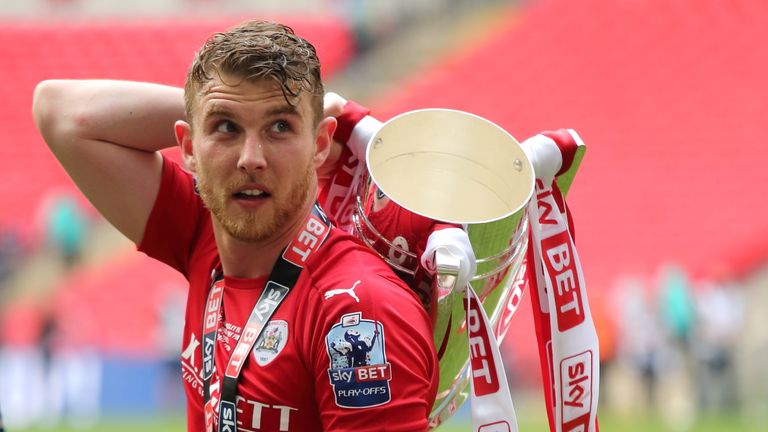 LONDON, ENGLAND - MAY 29: Sam Winnall of Barnsley with the trophy as he celebrates promotion after winning the Sky Bet League One Play Off Final between Ba