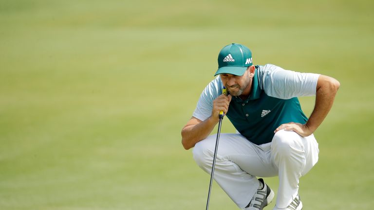 Sergio Garcia of Spain lines up a putt on the second green during the third round of THE PLAYERS Championship
