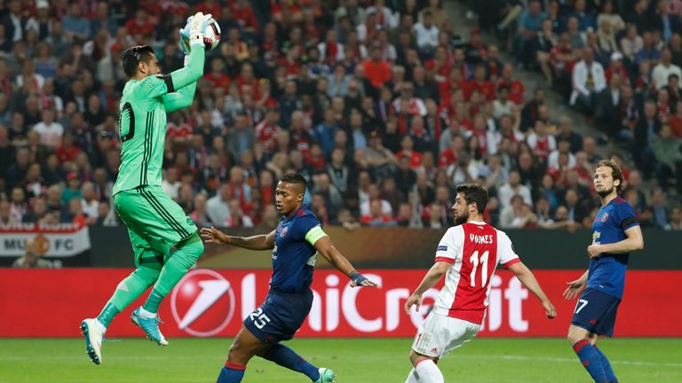 Manchester United's Argentinian goalkeeper Sergio Romero (L) makes a save during the UEFA Europa League final football match Ajax Amsterdam v Manchester Un