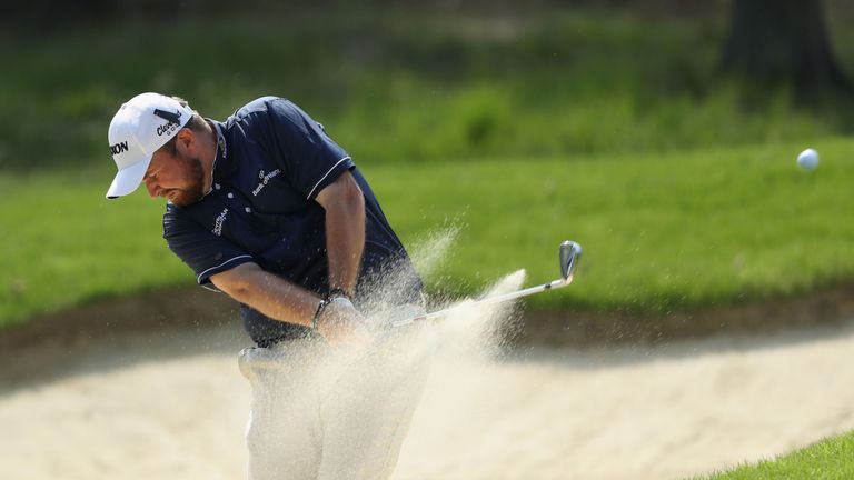 VIRGINIA WATER, ENGLAND - MAY 25:  Shane Lowry of Ireland plays out of a bunker on the ninth hole during day one of the BMW PGA Championship at Wentworth o