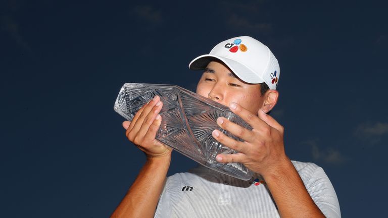 PONTE VEDRA BEACH, FL - MAY 14:  Si Woo Kim of South Korea celebrates with the winner's trophy after the final round of THE PLAYERS Championship at the Sta