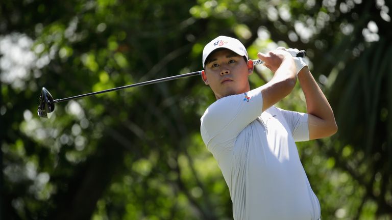 Si Woo Kim of South Korea plays his shot from the fifth tee during the final round of THE PLAYERS Championship