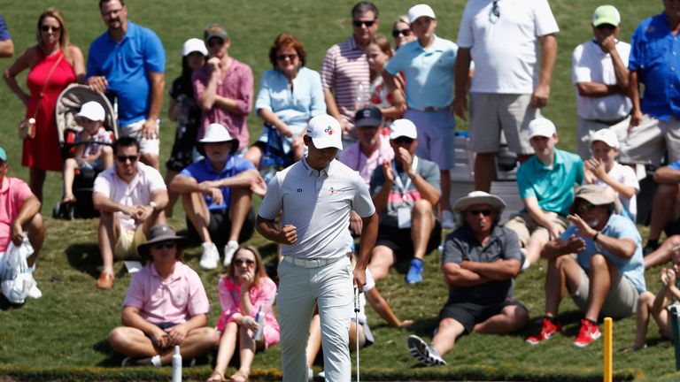 Si Woo Kim of South Korea reacts on the fourth green during the final round of THE PLAYERS Championship
