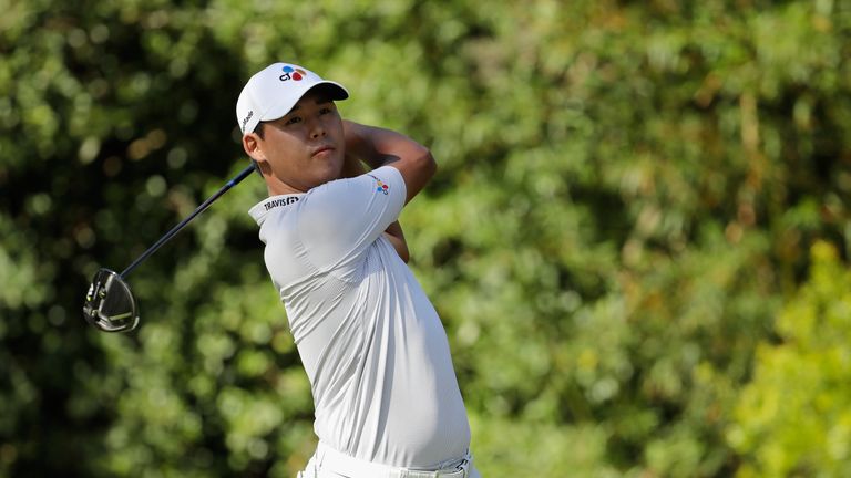Si Woo Kim of South Korea plays his shot from the 11th tee during the final round of THE PLAYERS Championship