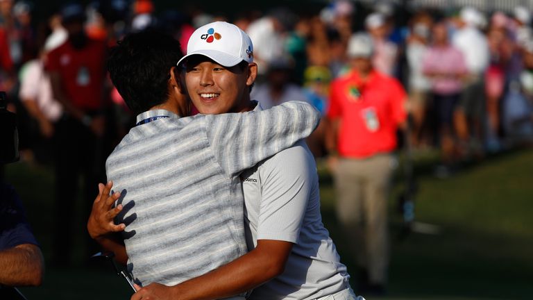 Si Woo Kim of South Korea celebrates on the 18th green after finishing 10 under to win during the final round of THE PLAYERS Championship