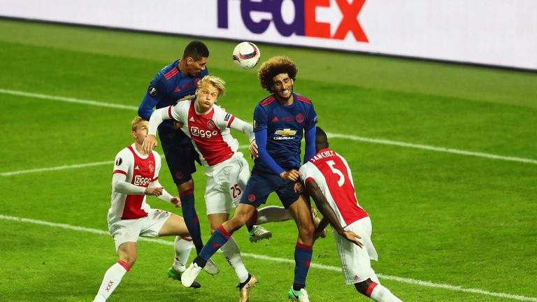 STOCKHOLM, SWEDEN - MAY 24:  Chris Smalling of Manchester United gets a head on the ball to assist Henrikh Mkhitaryan of Manchester United (Not Pictured) t