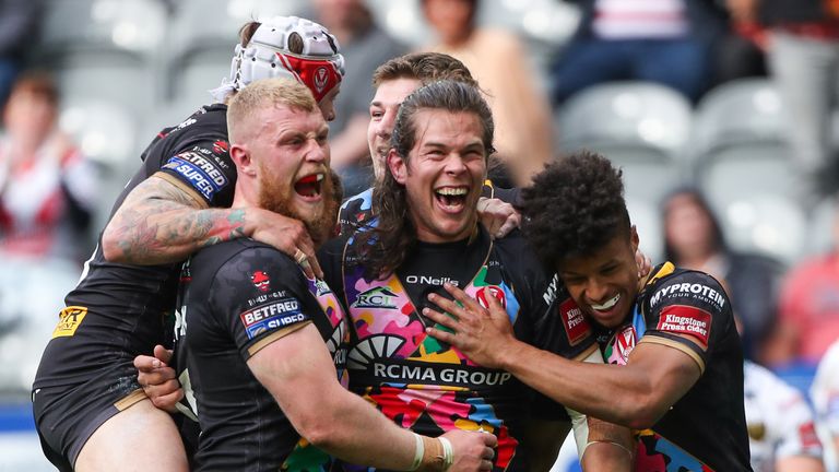 St Helens' Louie McCarthy-Scarsbrook celebrates his try.